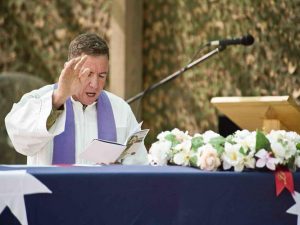 Padre Steve Brooks at a ramp ceremony